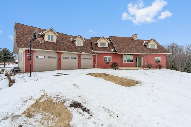 cape cod house featuring a garage