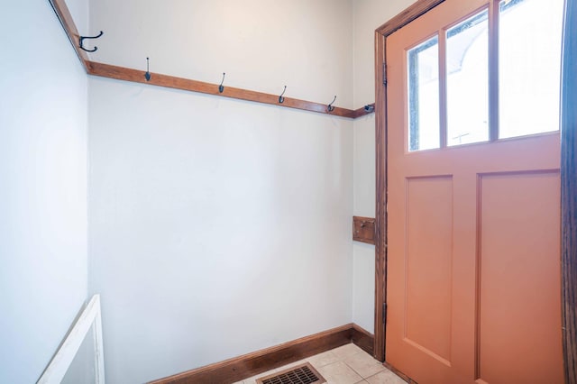 entryway featuring light tile patterned floors