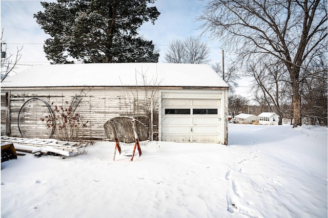 view of snow covered garage