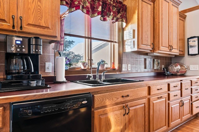 kitchen with sink, tasteful backsplash, and dishwasher