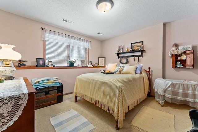 carpeted bedroom with a textured ceiling