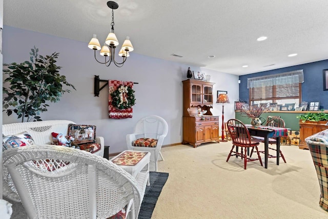 dining area with a textured ceiling, a notable chandelier, and light carpet