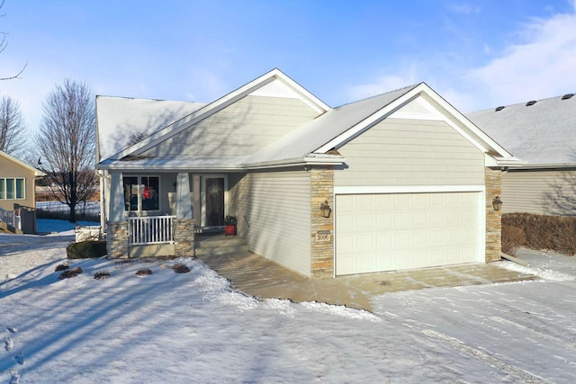 view of front of property featuring covered porch and a garage