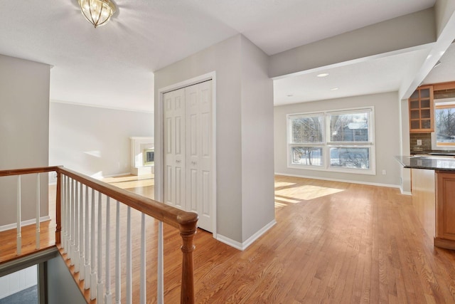 corridor featuring light hardwood / wood-style floors