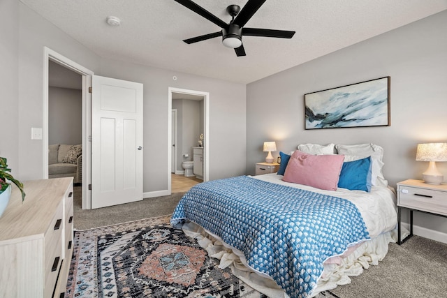 bedroom with ensuite bathroom, carpet flooring, a textured ceiling, and ceiling fan