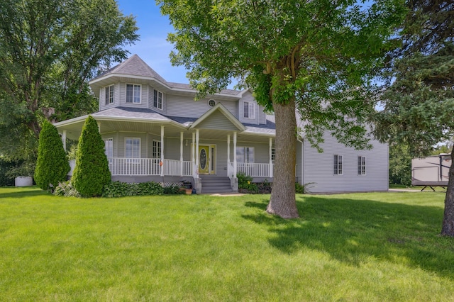 view of front of house featuring a front yard and covered porch