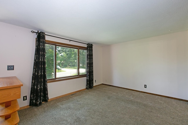 unfurnished room featuring carpet floors