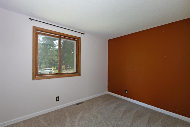 unfurnished room featuring carpet floors