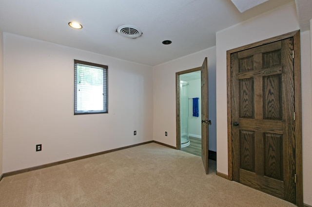 empty room with light colored carpet