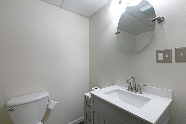 bathroom featuring toilet and vanity