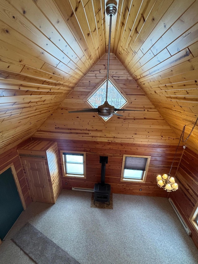 bonus room with lofted ceiling, wooden walls, carpet flooring, baseboard heating, and wooden ceiling