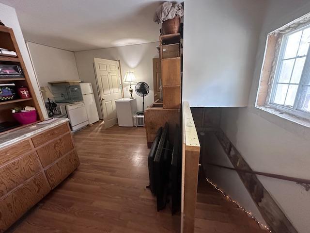 3579 Rodgers Ave E, Eagles Nest Twp, MN 55731 - kitchen with wood finished floors and freestanding refrigerator