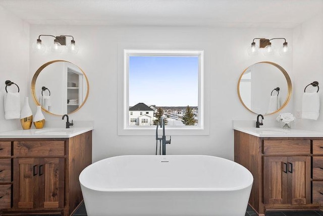 bathroom with a bathtub and vanity