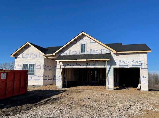 unfinished property featuring a garage