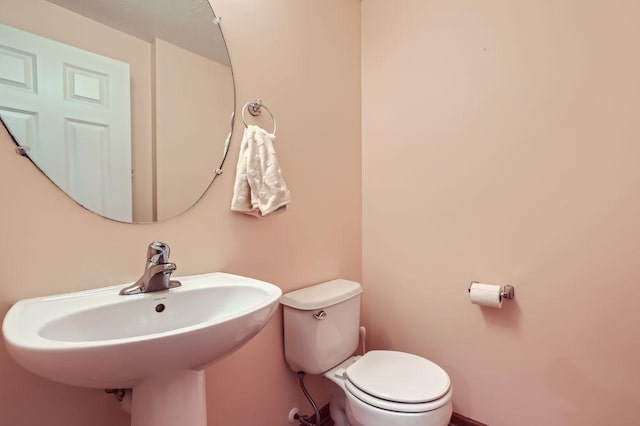 bathroom featuring sink and toilet