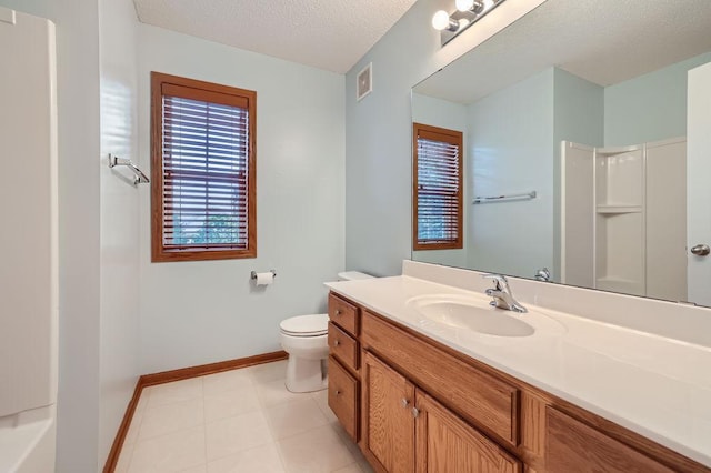 bathroom featuring a shower, vanity, and toilet