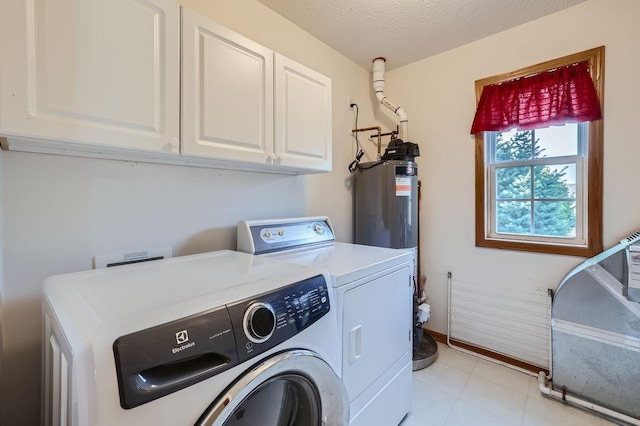 laundry room with cabinets, separate washer and dryer, a textured ceiling, and water heater