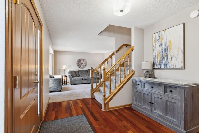 interior space with hardwood / wood-style floors and a textured ceiling