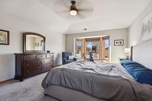 bedroom featuring lofted ceiling, light colored carpet, a textured ceiling, access to outside, and ceiling fan