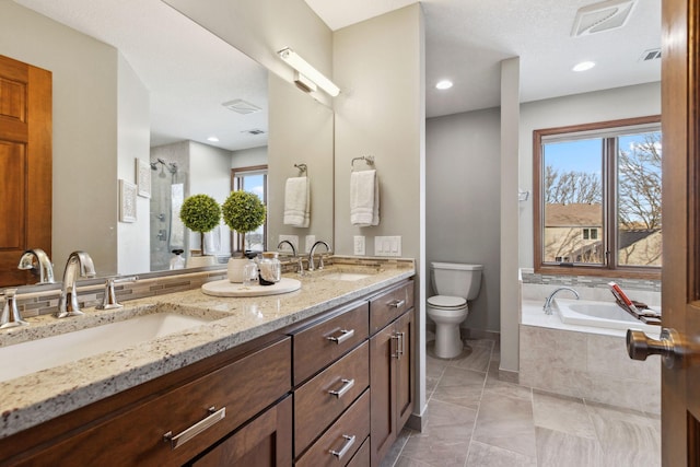 full bathroom featuring independent shower and bath, vanity, tile patterned floors, and toilet