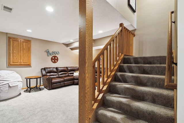 staircase with carpet floors