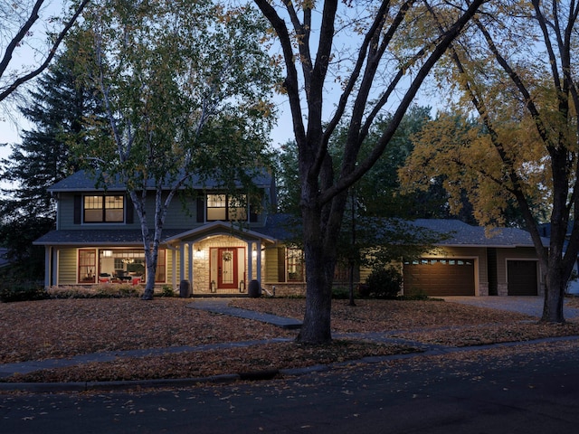 view of front facade with covered porch and a garage