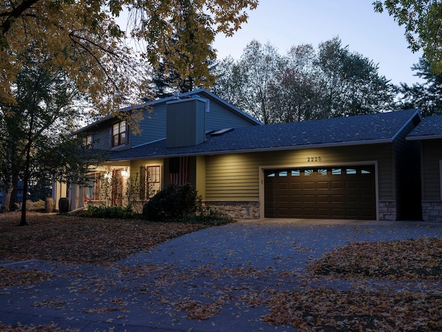 view of front of property with a garage