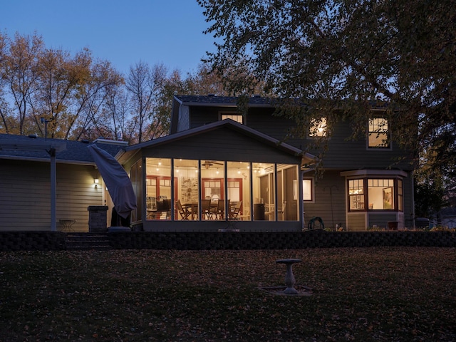 back of house with a sunroom