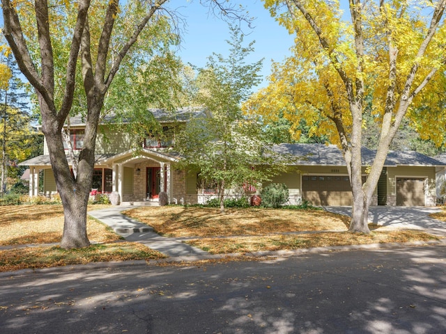 view of front of house with a porch and a garage