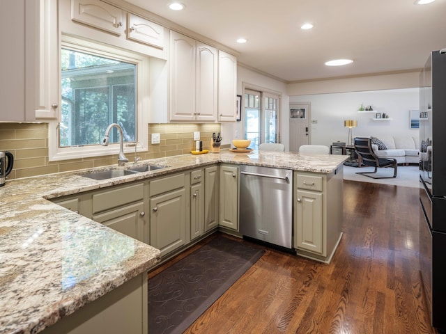 kitchen featuring sink, dishwasher, kitchen peninsula, light stone countertops, and dark hardwood / wood-style floors