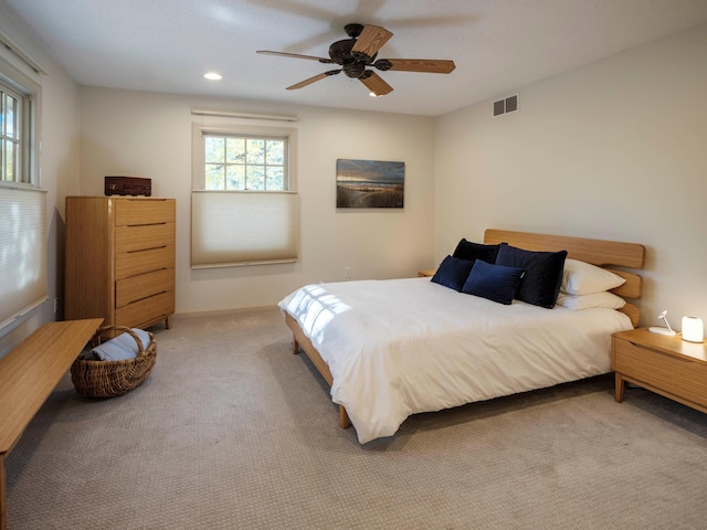 carpeted bedroom featuring ceiling fan