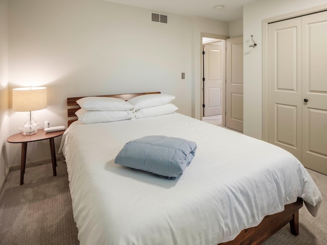 bedroom featuring a closet and carpet