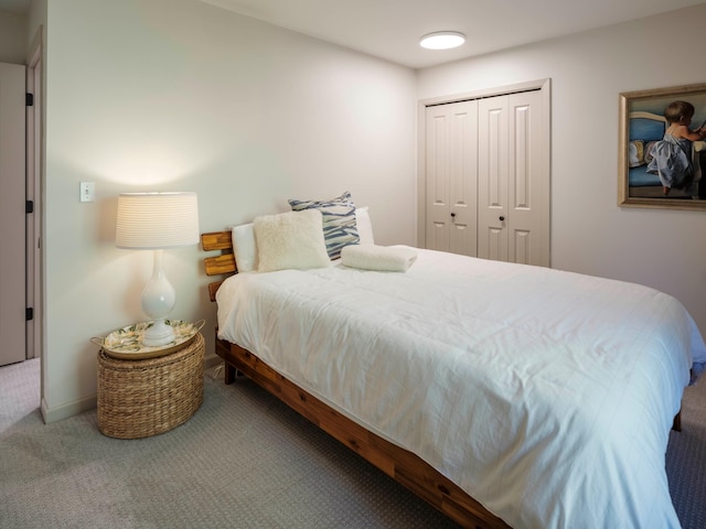 carpeted bedroom featuring a closet