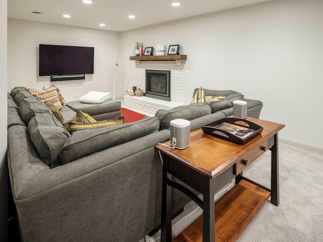 living room featuring carpet and a fireplace