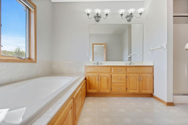 bathroom with vanity and a tub