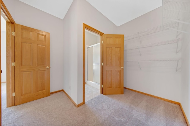 unfurnished bedroom featuring carpet and a closet