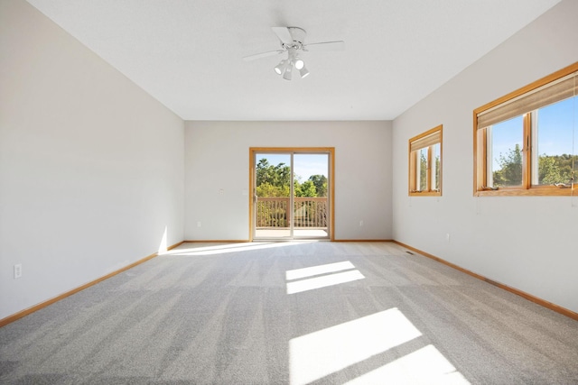 carpeted empty room with ceiling fan