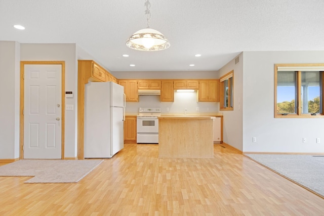 kitchen with a center island, light brown cabinets, light hardwood / wood-style floors, decorative light fixtures, and white appliances