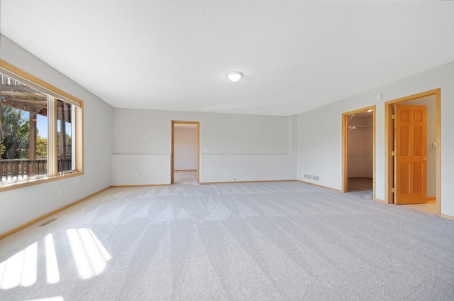 unfurnished room with light carpet