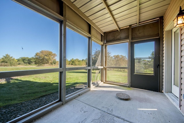 unfurnished sunroom with plenty of natural light