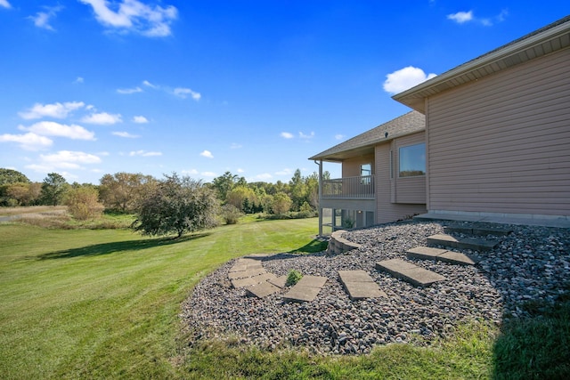 view of yard featuring a balcony