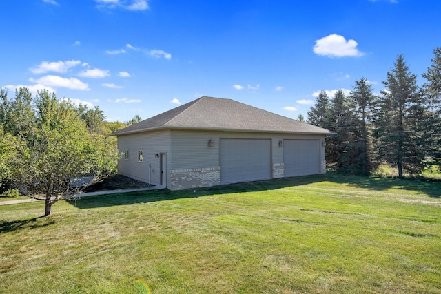 exterior space featuring a yard and a garage