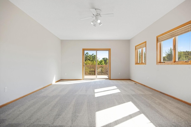 16377 Eidelweiss St NW, Andover, MN 55304 - unfurnished room featuring baseboards, a ceiling fan, and light colored carpet