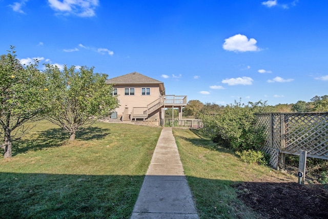 16377 Eidelweiss St NW, Andover, MN 55304 - view of yard featuring a deck, fence, and stairway