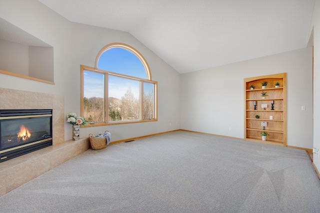 16377 Eidelweiss St NW, Andover, MN 55304 - living area with a high end fireplace, carpet, visible vents, vaulted ceiling, and baseboards