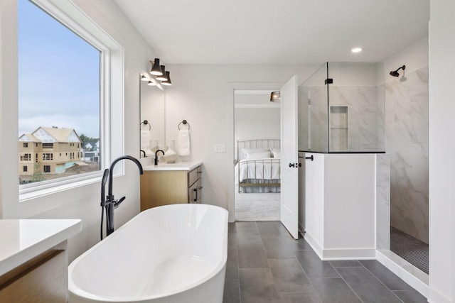 bathroom with plus walk in shower and vanity