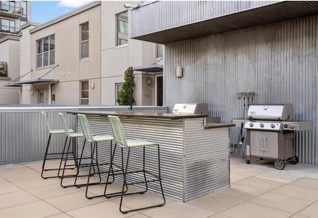 view of patio / terrace with grilling area and an outdoor bar