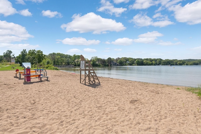 view of play area with a water view