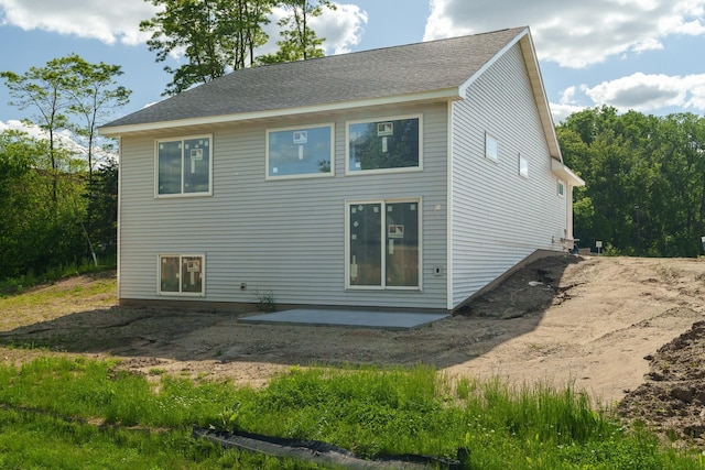 rear view of property featuring a patio area