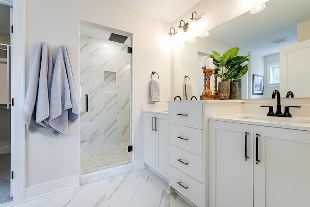 bathroom featuring vanity and an enclosed shower